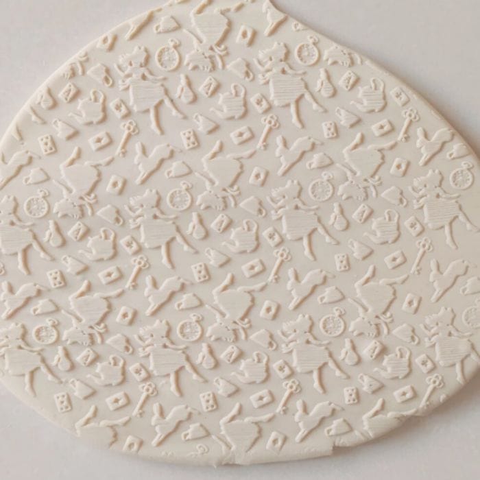 Close-up of Acrylic Embossed Rolling Pin with Tea Party Wonderland Design | Ideal for Fondant Details