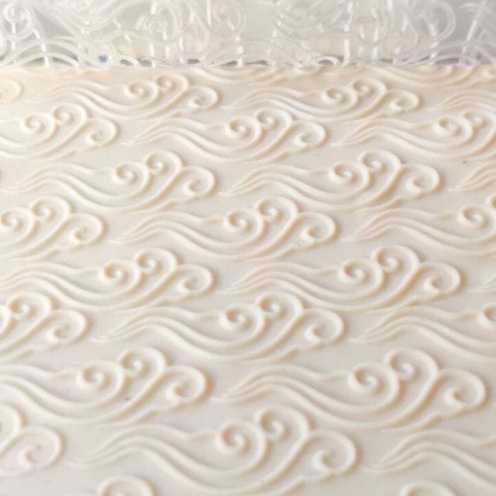Close-up of Acrylic Embossed Rolling Pin with Cascading Current Design | Ideal for Fondant Details