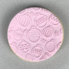 Cookie with Christmas Bauble pattern created using an acrylic fondant debosser