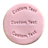 Close-up of embossed fondant cookie with custom text with a white background