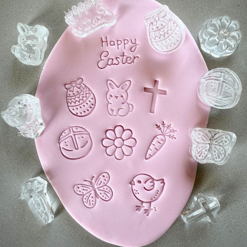 Close-up of Easter-themed mini cookie stamps designed for decorating fondant cookies.