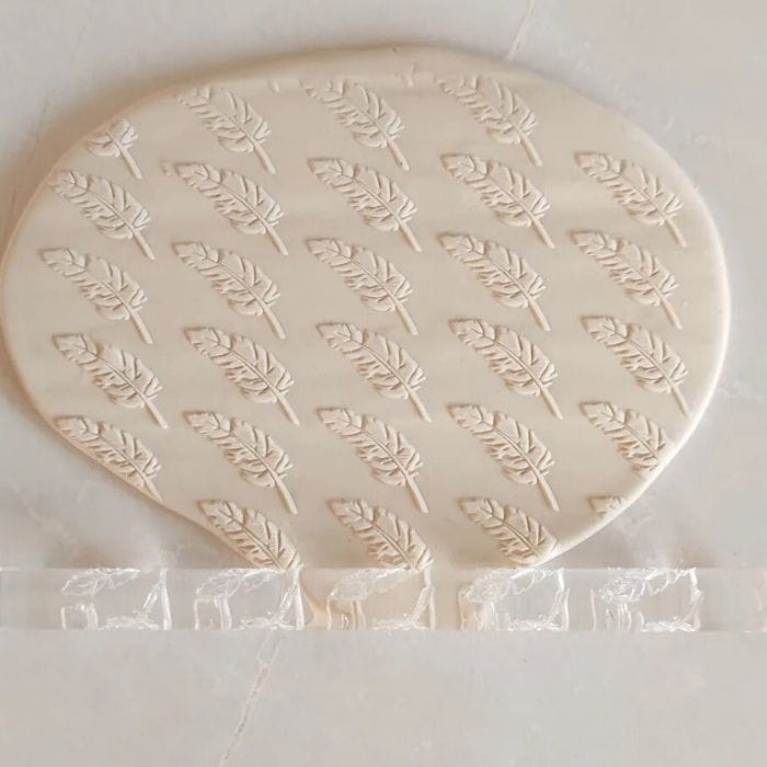 Close-up of Acrylic Embossed Rolling Pin with Feather Design | Ideal for Fondant Details