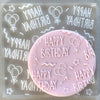 Cookie with Happy Birthday Celebrations pattern created using an acrylic fondant debosser