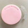 Curved 'Happy Birthday' stamp design on celebratory fondant cookie