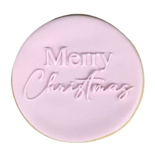 Cookie with Merry Christmas pattern created using an acrylic fondant debosser