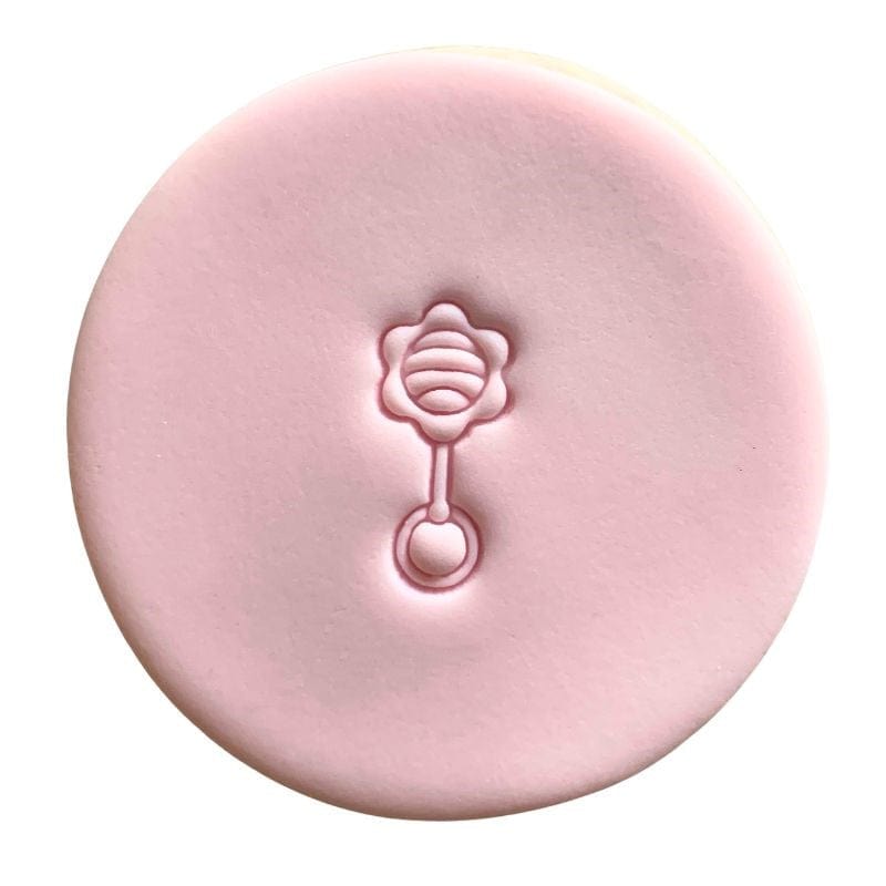 fondant cookie with baby shower rattle stamp design