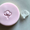 Balloon-themed stamp impression on celebratory fondant cookie