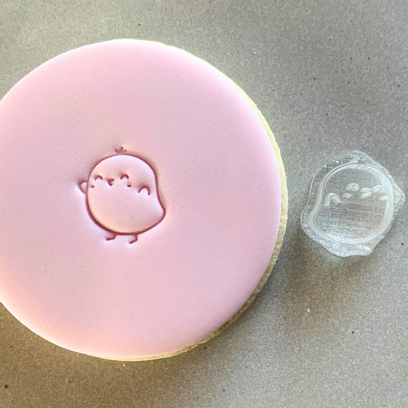 Close-up of Pixie Patio's Mini Cute Chicken Cookie Stamp on a cookie.