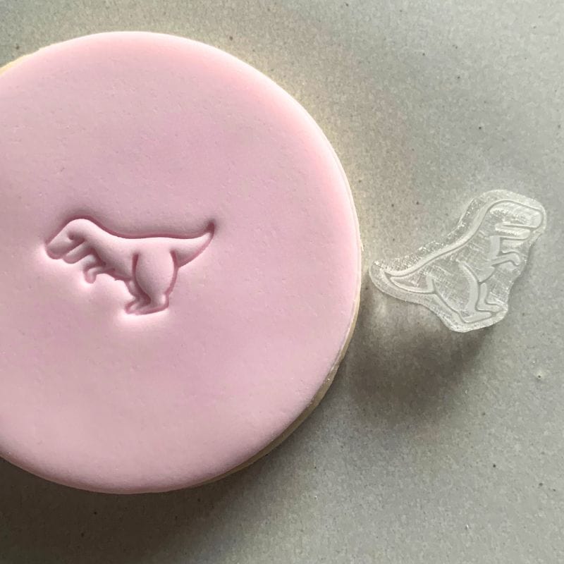 Mini Dinosaur Cookie Stamp used to create decorated fondant cookie