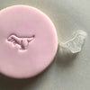 Mini Dinosaur Cookie Stamp used to create decorated fondant cookie