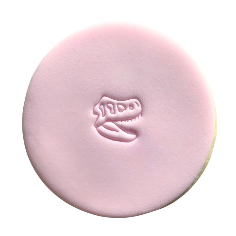 Mini Dinosaur Fossil Stamp creating fun fondant cookie design