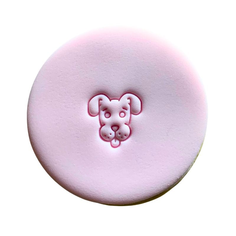 Mini Dog Cookie Stamp creating cute dog design on fondant.