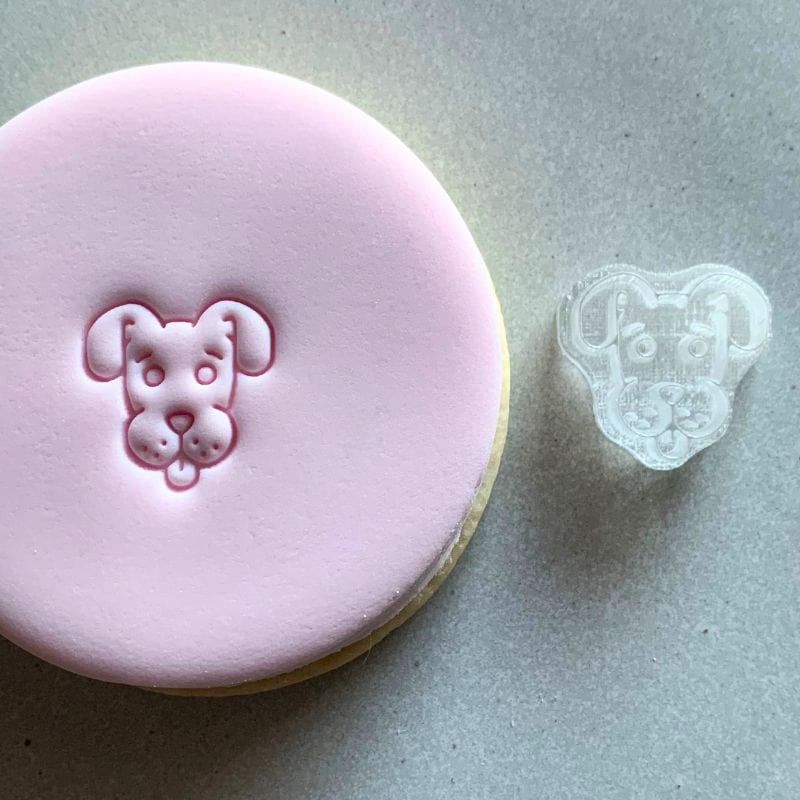 Mini Dog Cookie Stamp used to create decorated fondant cookie.