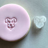 Mini Dog Cookie Stamp used to create decorated fondant cookie.