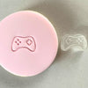 gaming-themed fondant cookie with controller stamp