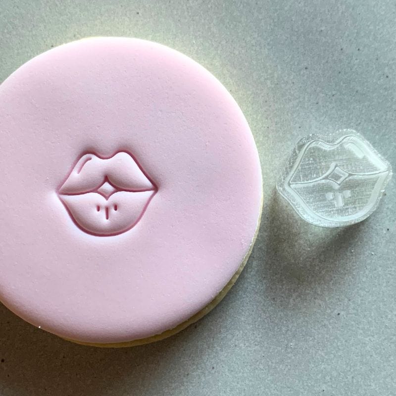 Mini Lips Cookie Stamp used to create decorated fondant cookie