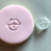Mini Lips Cookie Stamp used to create decorated fondant cookie