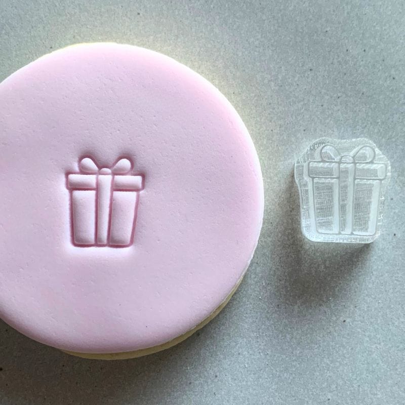 Present design stamp on festive birthday fondant cookie