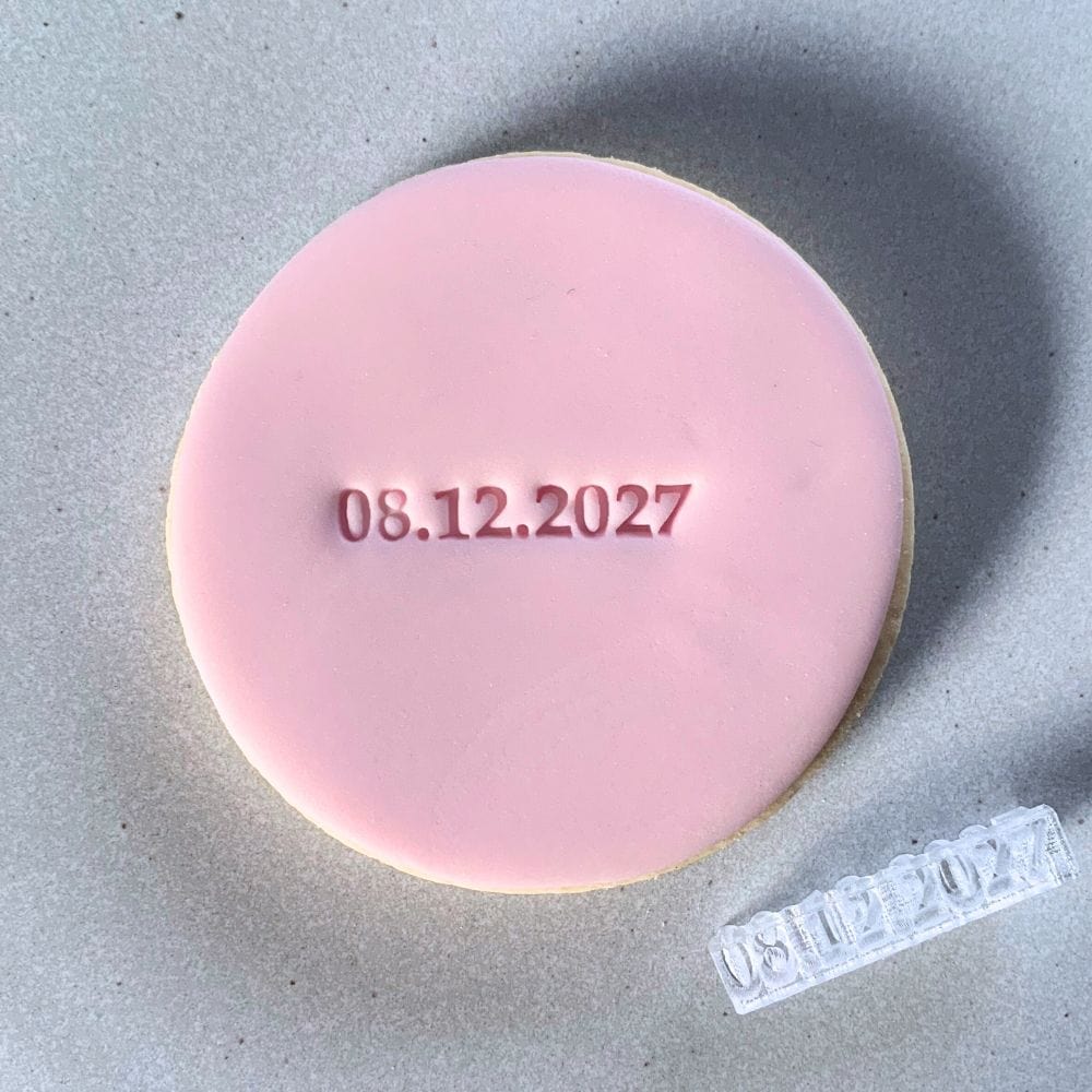 Custom date cookie stamp creates a beautiful date design on fondant cookie