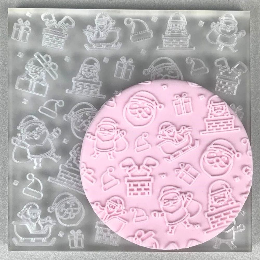 Cookie with Santa Christmas pattern created using an acrylic fondant debosser