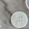 Cookie with Thank You pattern created using an acrylic fondant debosser