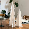 elegant acrylic christmas tree centerpiece on dining table for modern holiday styling