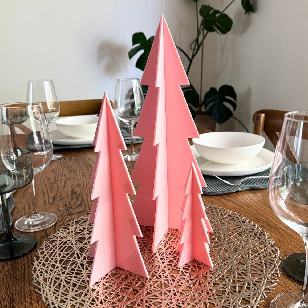 Pink acrylic Christmas tree used as a festive table decor piece