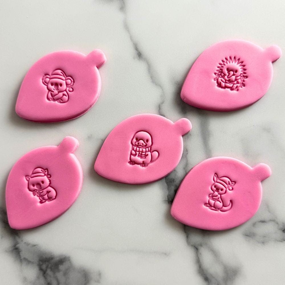 australian christmas animal fondant stamps with rounded gumleaf cutter and embossed pink fondant