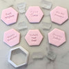 Set of six pink fondant cookies with birthday message stamps and matching hexagon cutter