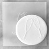 Cookie with Champagne Wedding pattern created using an acrylic fondant debosser