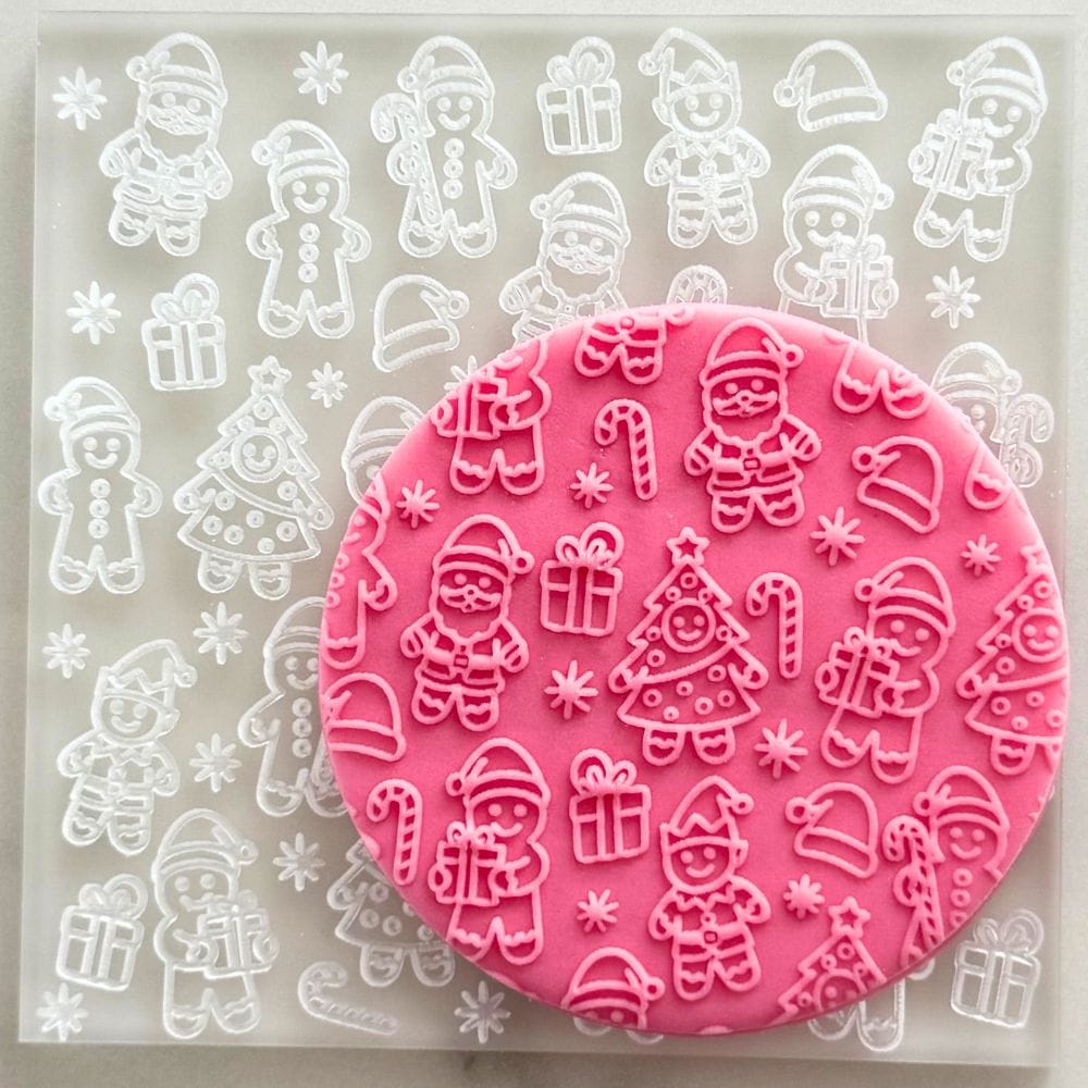 christmas friends cookie stamp embosser on pink fondant cookie