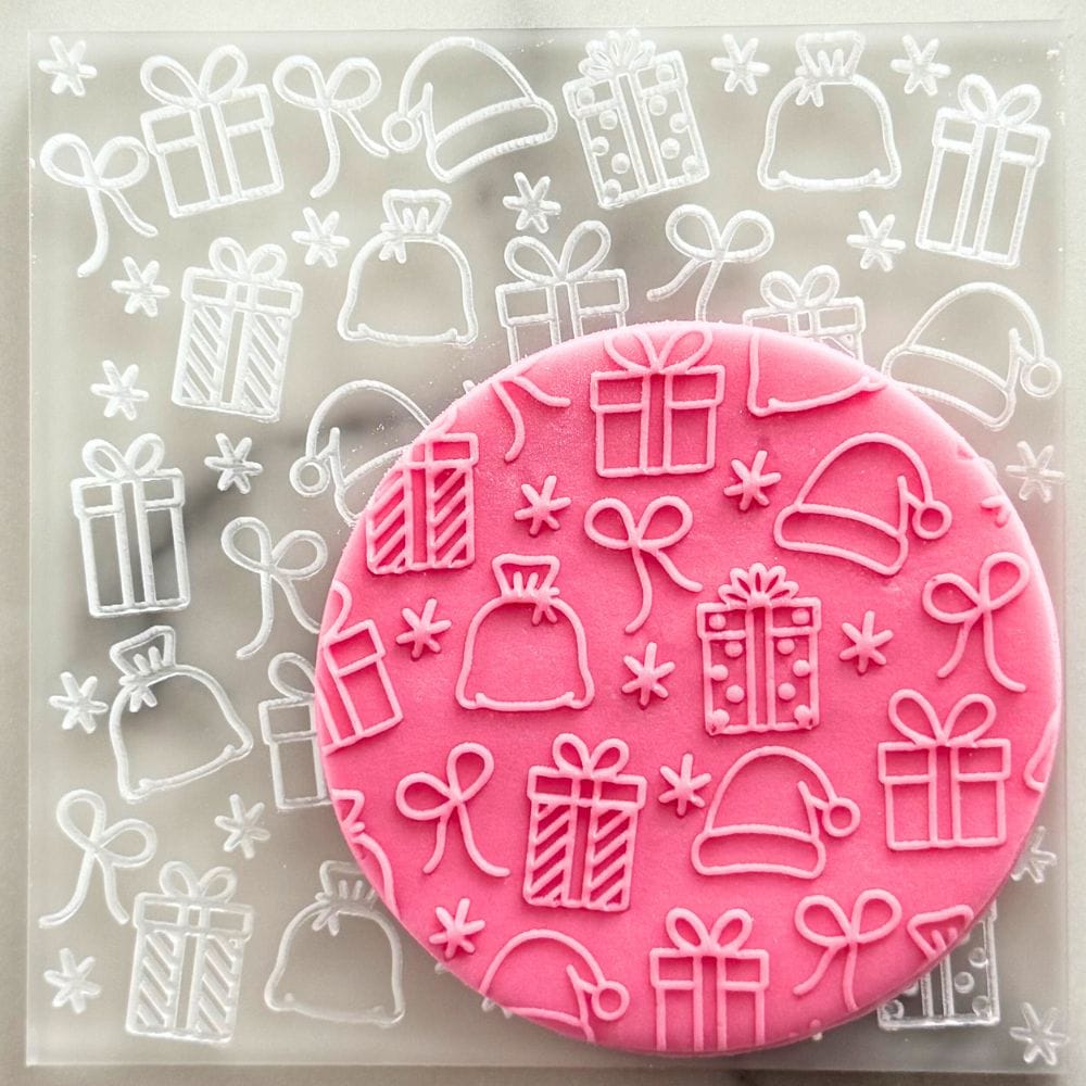 christmas gifts cookie stamp embosser on pink fondant