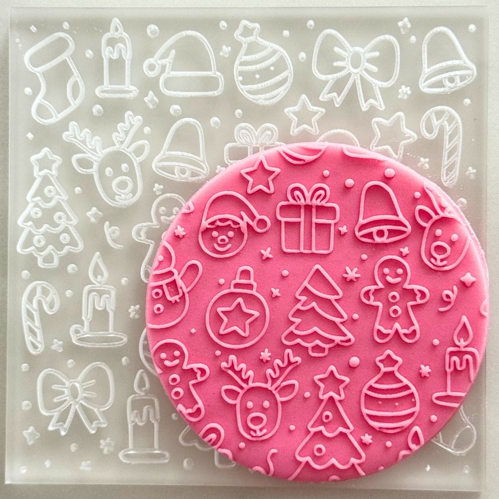 christmas party cookie stamp embosser on pink fondant cookie