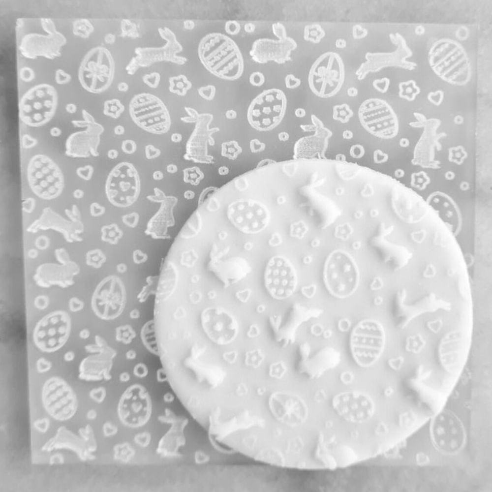 Cookie with Easter Themed pattern created using an acrylic fondant debosser.
