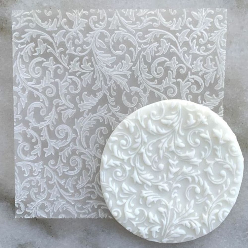 Cookie with Floral Background pattern created using an acrylic fondant debosser