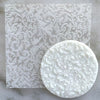 Cookie with Floral Background pattern created using an acrylic fondant debosser