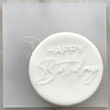 Cookie with Happy Birthday cursive pattern created using an acrylic fondant debosser