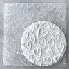 Cookie with Love Hearts pattern created using an acrylic fondant debosser