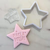 Star cookie cutter with fondant and Make a Wish stamp on marble surface.