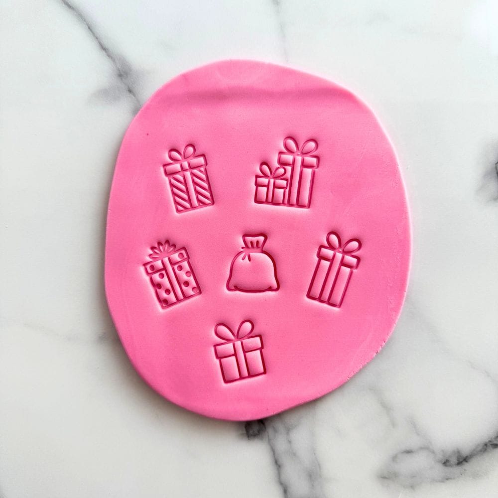 mini christmas gift box and santa sack fondant cookie stamp set on pink fondant