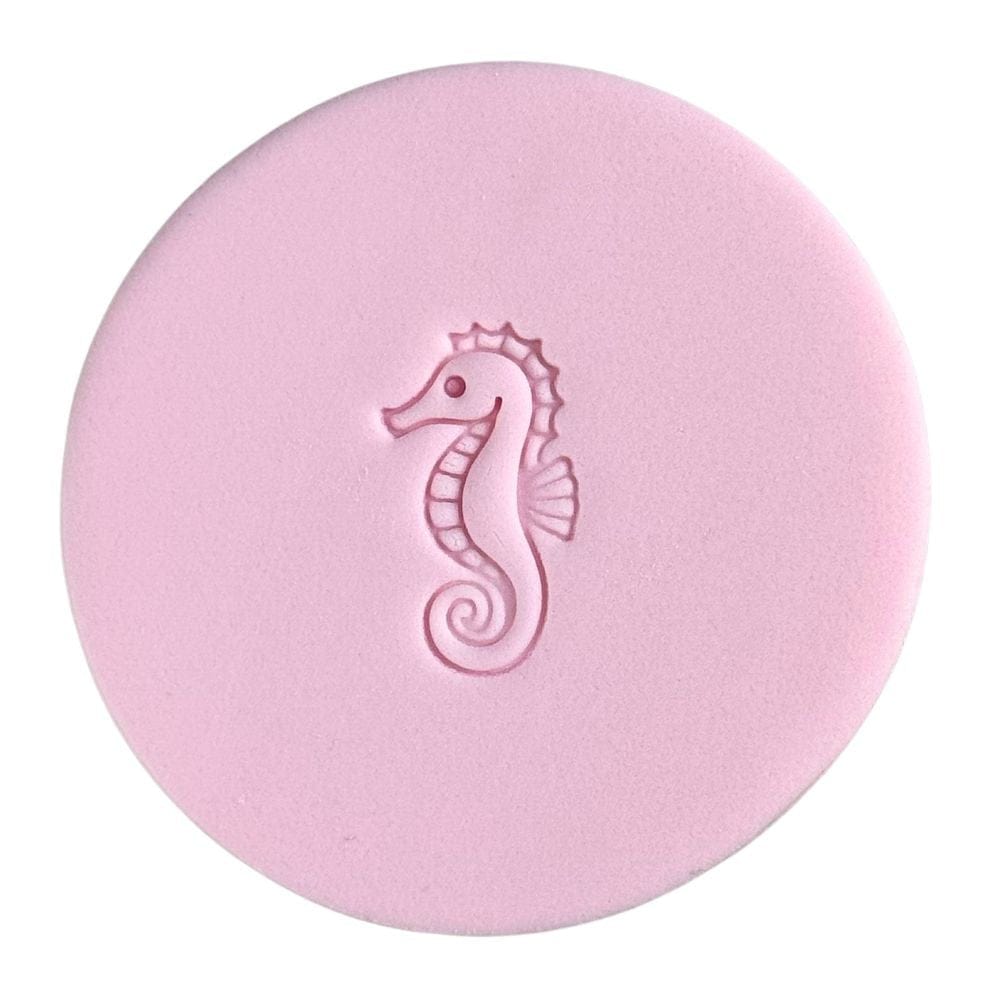 mini elegant seahorse cookie stamp on pink fondant for under the sea baking