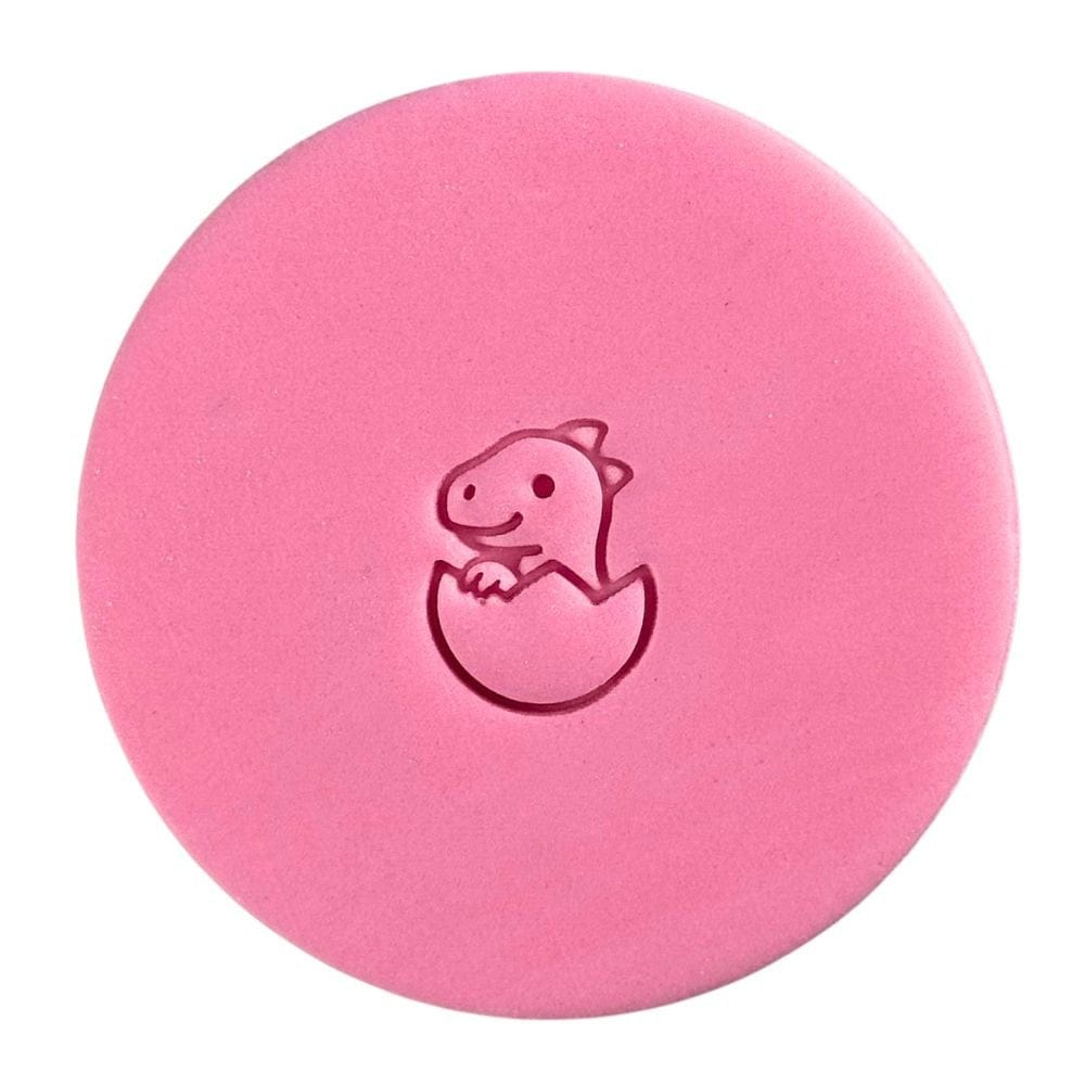 Mini hatching dinosaur fondant embossing on pink circle