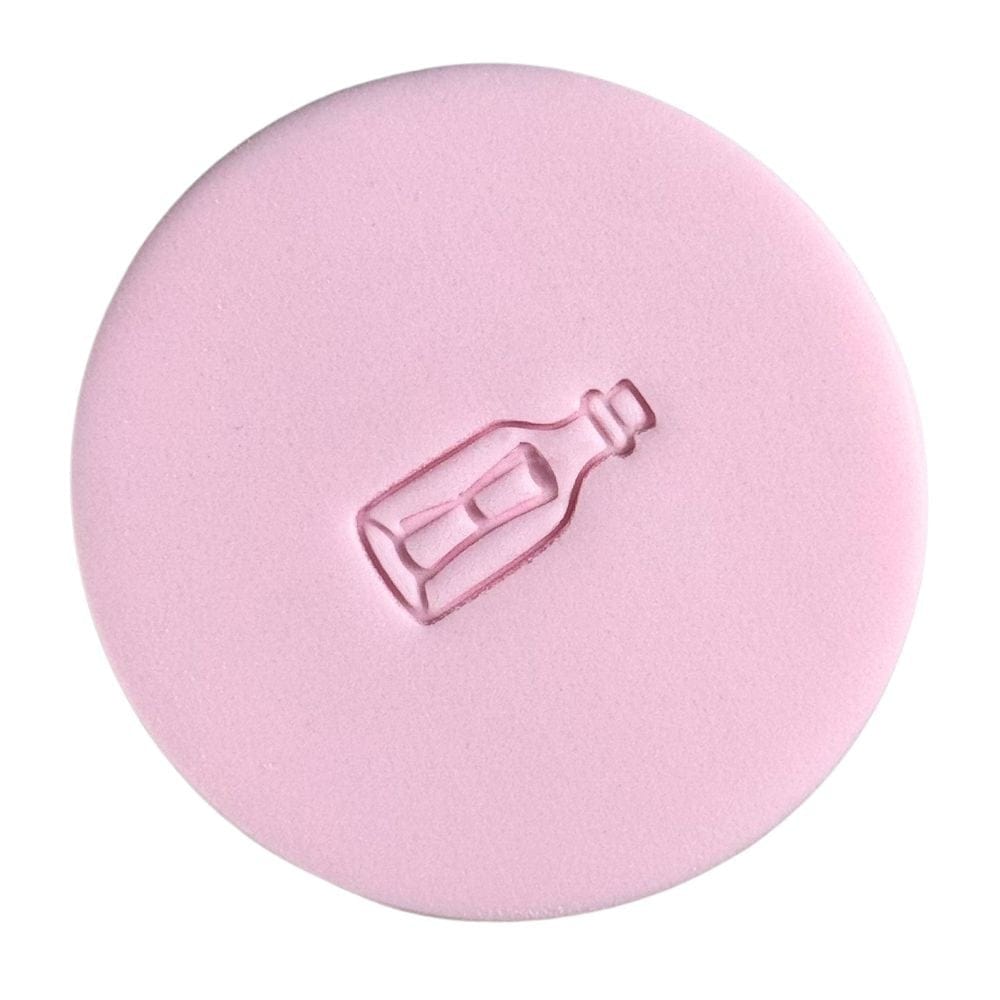 mini message in a bottle cookie stamp on pink fondant for ocean cookies