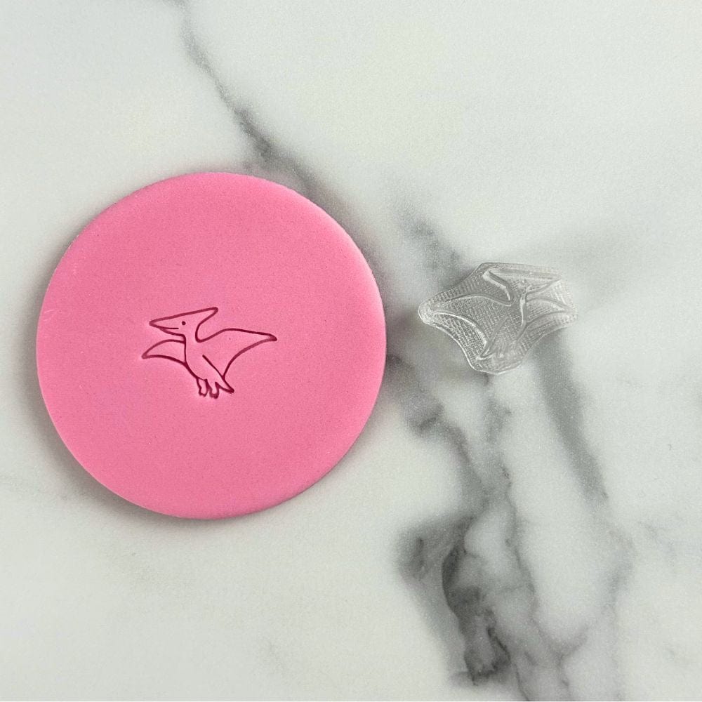 Mini pterodactyl cookie stamp with fondant imprint