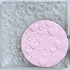 fondant cookie stamp with mixed heart designs and textures
