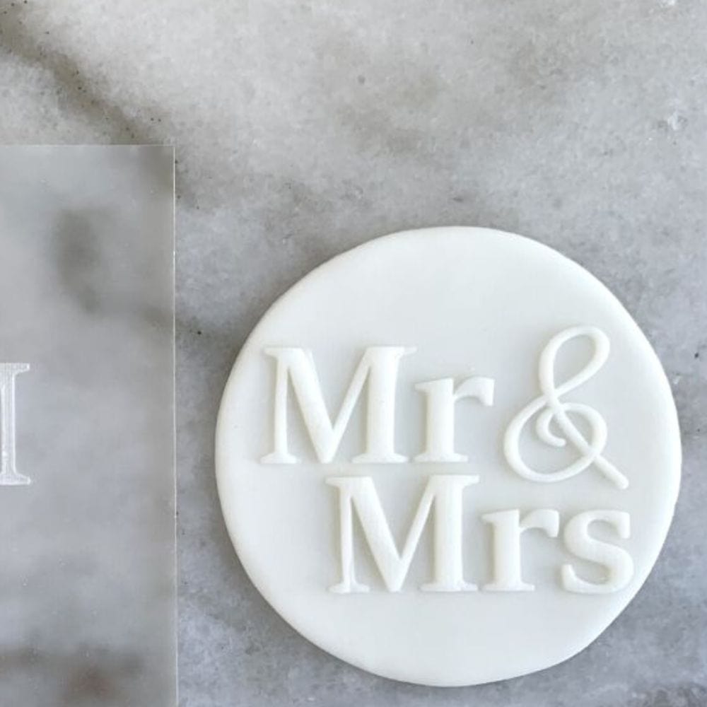 Cookie with Mr & Mrs pattern created using an acrylic fondant debosser