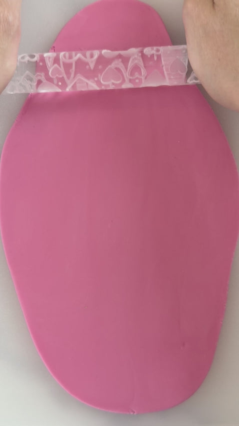 Pixie Roller sweethearts embossed textured rolling pin rolling heart pattern into fondant