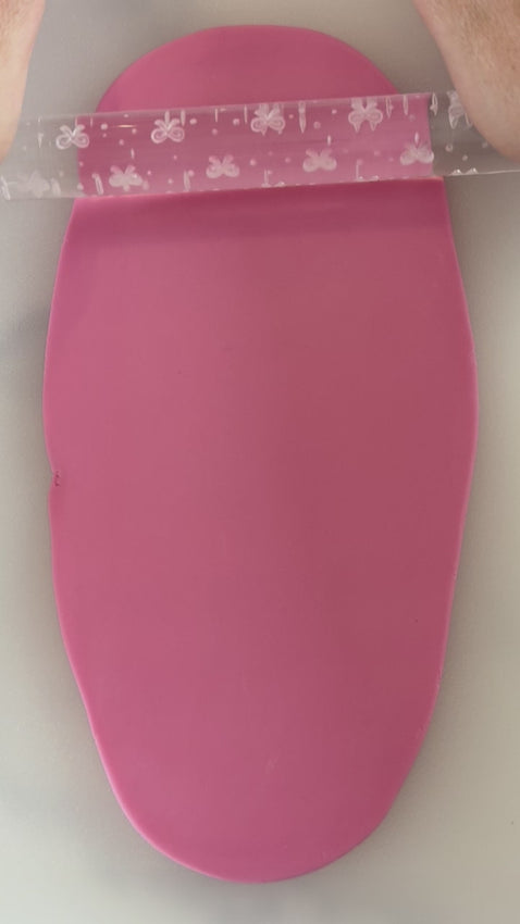 Pixie Roller cherries embossed textured rolling pin rolling cherry pattern into fondant