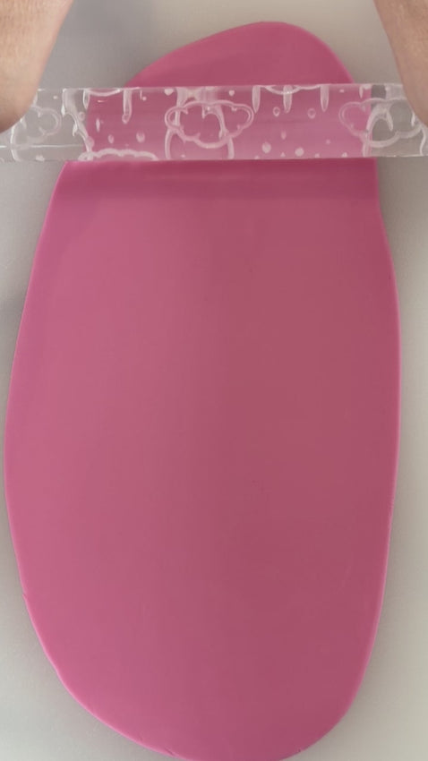 Pixie Roller clouds and rain embossed textured rolling pin rolling soft cloud pattern into fondant