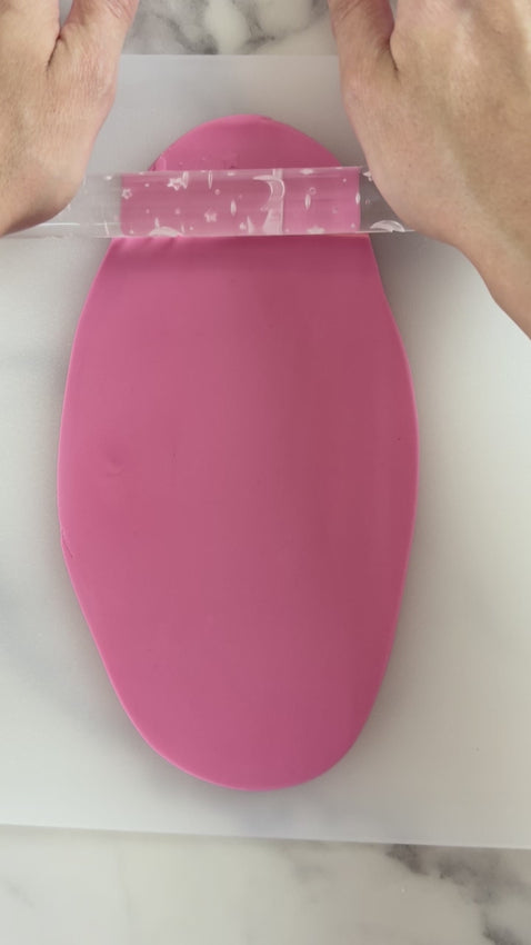 Pixie Roller moonlight skies embossed textured rolling pin rolling moon and star pattern into fondant